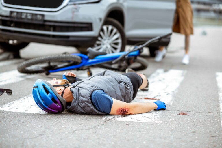 Road accident with injured cyclist and woman driver