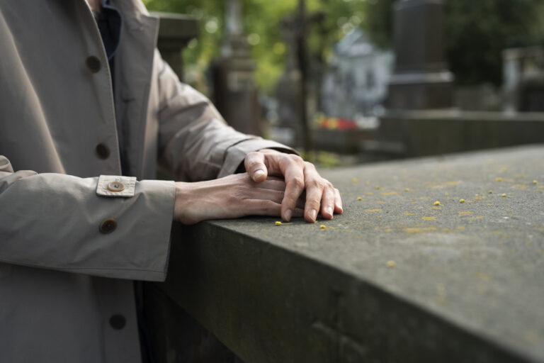 Woman visiting graveyard